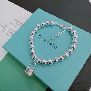 Tiffany & Co. Silver Bead Bracelet with Padlock Charm